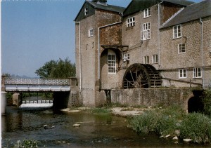 The back of Palmers Brewery in Bridport, showing the River Brit and waterwheel